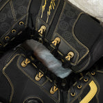 Vans Invado Pro Limited Edition Snowboard Boots 2026 - Black snowboard boots with yellow accents and a textured pattern on the side.