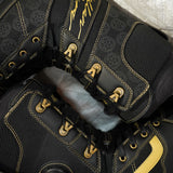 Vans Invado Pro Limited Edition Snowboard Boots 2026 - Black snowboard boots with yellow accents and a textured pattern on the side.