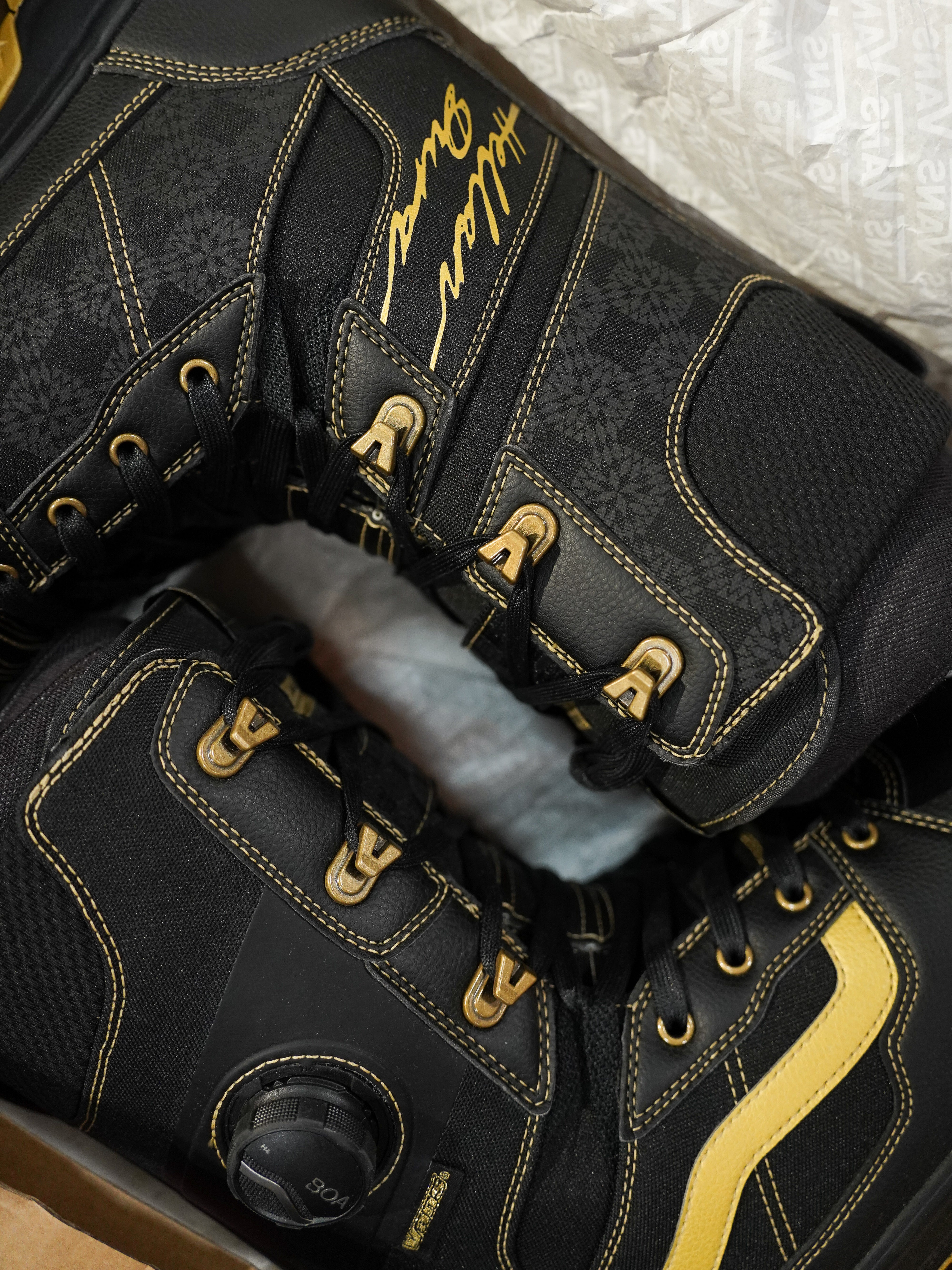 Vans Invado Pro Limited Edition Snowboard Boots 2026 - Black snowboard boots with yellow accents and a textured pattern on the side.