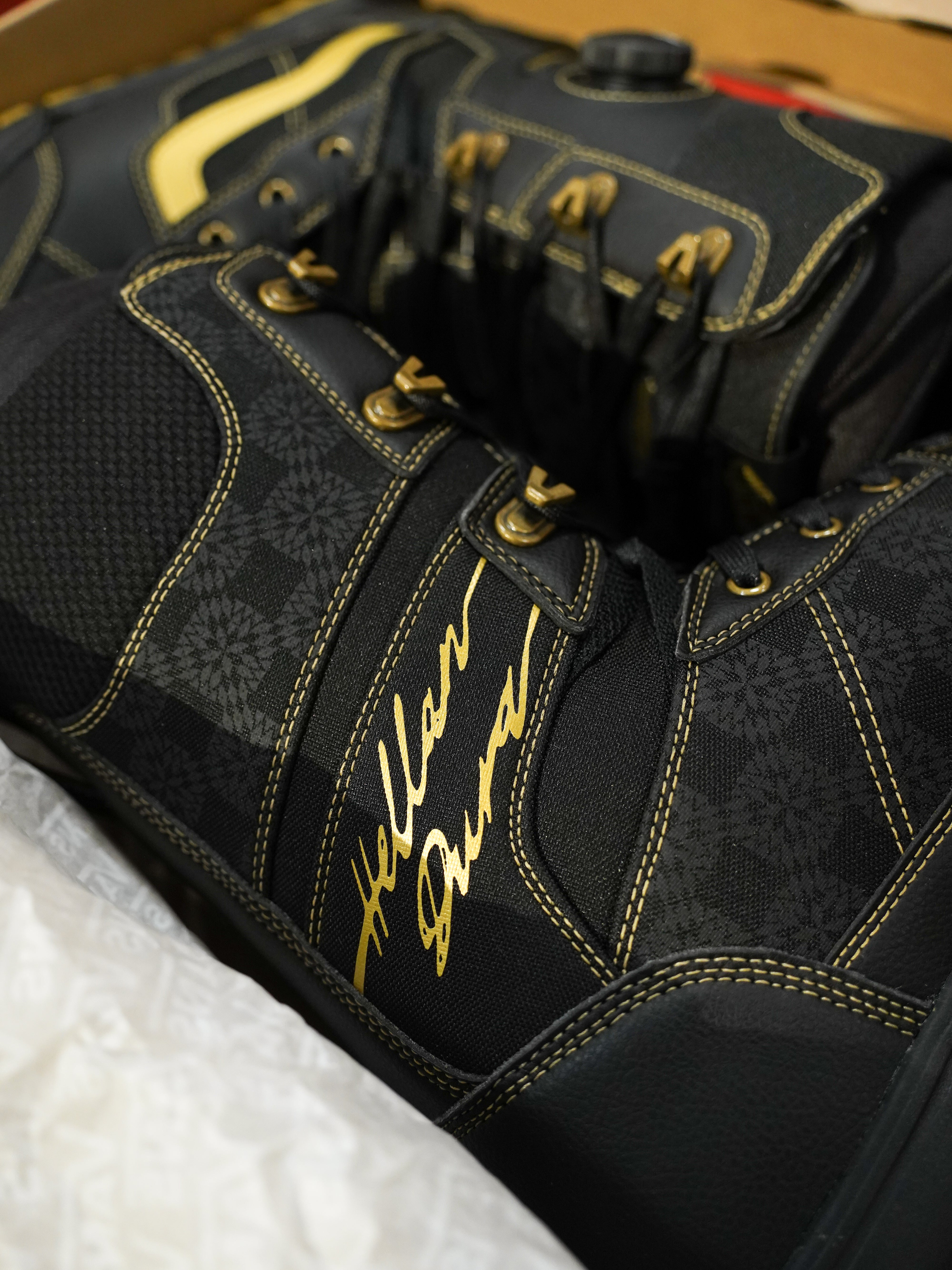 Vans Invado Pro Limited Edition Snowboard Boots 2026 - Black snowboard boots with yellow accents and a textured pattern on the side.