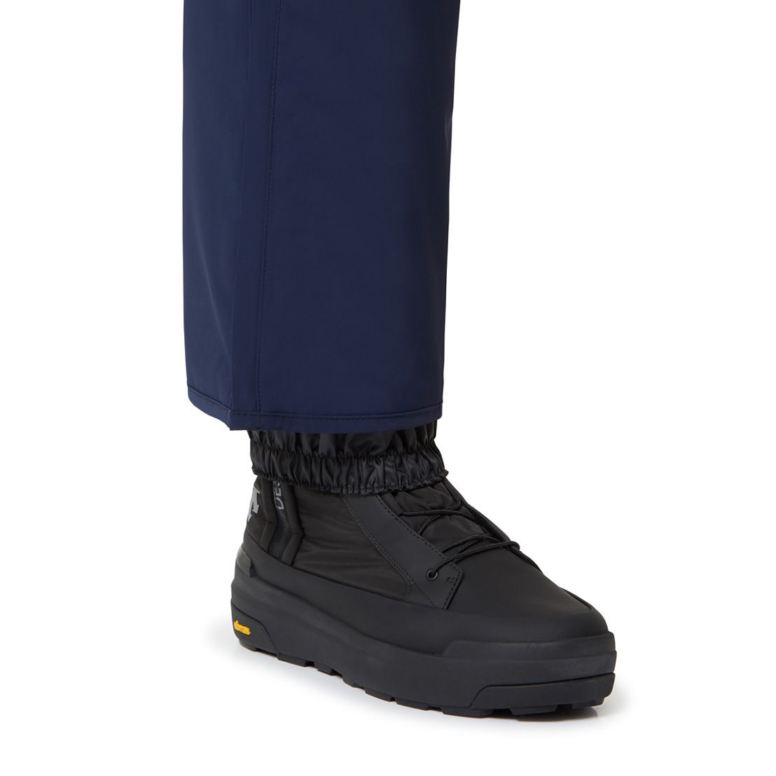 Descente Swiss Insulated Pant 2025 - A pair of navy blue insulated ski pants with a zippered pocket on the side.