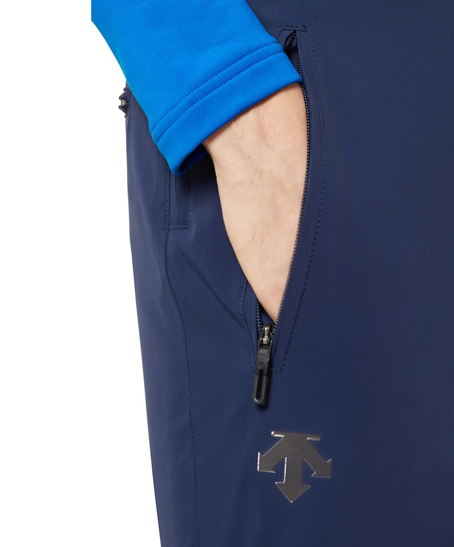 Descente Swiss Insulated Pant 2025 - A pair of navy blue ski pants with a zipper on the left leg, featuring a black pull tab and a small logo near the bottom.