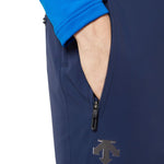 Descente Swiss Insulated Pant 2025 - A pair of navy blue ski pants with a zipper on the left leg, featuring a black pull tab and a small logo near the bottom.