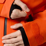 Descente Cody Insulated Jacket 2025 - A bright orange jacket with a black zipper and two zippered pockets on either side.