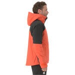 Descente Cody Insulated Jacket 2025 - A black jacket with a red zipper and hood, worn by a model on a plain white background.