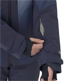 Descente Women's Swiss Insulated Jacket - A woman wearing a navy blue jacket with black accents and a zipper down the front, holding it open to show off its light gray interior lining.