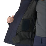 Descente Women's Swiss Insulated Jacket 2025 - A navy blue jacket with a zippered front and two pockets on either side, worn by a model against a white background.