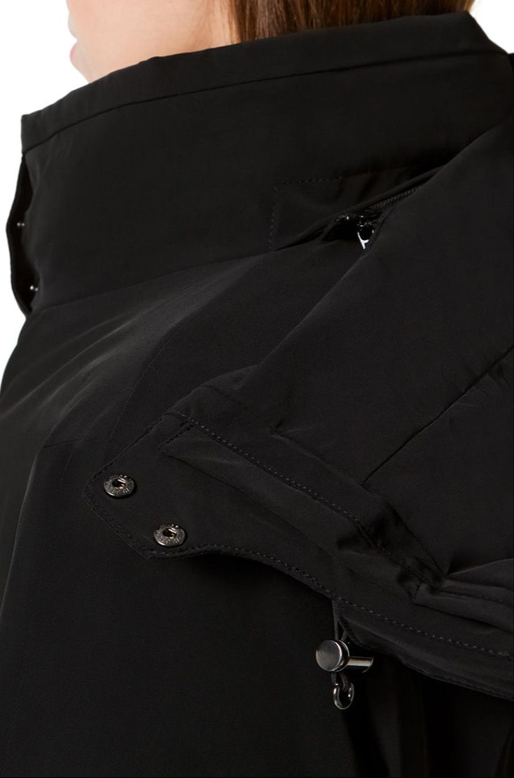 Descente Women's Kelly Insulated Jacket - A black insulated jacket with a high collar and zippered pockets on both sides.