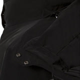 Descente Women's Kelly Insulated Jacket - A black insulated jacket with a high collar and zippered pockets on both sides.