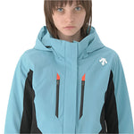 Descente Women's Lisa Insulated Jacket 2025 - A light blue jacket with a hood, featuring two zippered pockets on the front and an orange zipper pull.