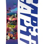 CAPiTA - Junior's Children Of The Gnar Snowboard 2025 is shown from a front perspective, featuring a purple background with a collage of various images and graphics.