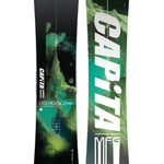 CAPiTA Outerspace Living Snowboard 2025 - A black snowboard with a green and blue abstract design featuring a mountain peak, planets, and stars.