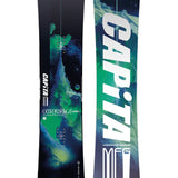 CAPiTA Outerspace Living Snowboard 2025 - A snowboard with a green and blue abstract design featuring a mountain range, set against a black background.