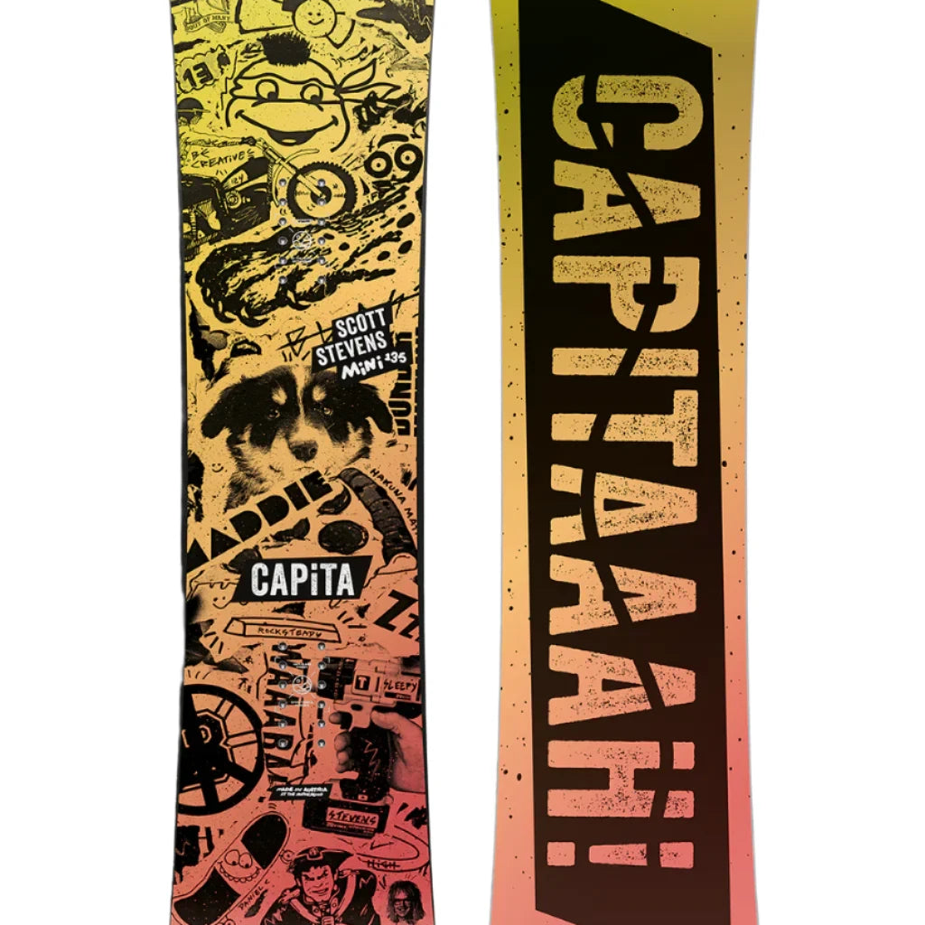 CAPiTA - Junior's Scott Stevens Mini Snowboard 2025 is a snowboard with a yellow background and black graphics of various shapes, including a smiling face, a fish, and a mountain peak.