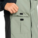 Quiksilver Utility Shell Bib 2025 - A sage green bib with two front pockets and a black logo on the left leg.