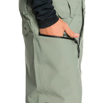 Quiksilver Utility Shell Bib 2025 - Sage green bib with multiple pockets and a black zipper on the right side.
