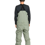 Quiksilver Utility Shell Bib - A pair of olive green snow pants with a black zipper and two zippered pockets on the side.