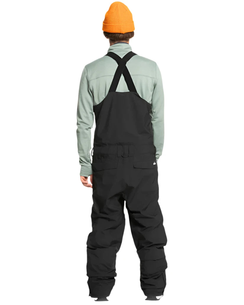 Quiksilver Utility Shell Bib - A black bib-style snow pant with a utility design, featuring multiple pockets and buckles on the side.