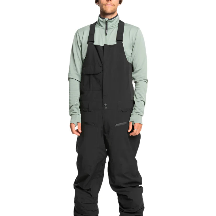 Quiksilver Utility Shell Bib - A black bib-style snow pant with a utility design, featuring multiple pockets and buckles on the side.