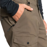 Quiksilver Utility Shell Pant 2025 - A pair of khaki-colored pants with a zippered pocket on the thigh and a button fly.