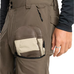 Quiksilver Utility Shell Pant 2025 - A pair of khaki-colored pants with a zippered pocket on the thigh and a black drawstring at the waist.