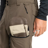Quiksilver Utility Shell Pant 2025 - A pair of khaki-colored pants with a zippered pocket on the thigh and a black drawstring at the waist.