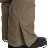 Quiksilver Utility Shell Pant 2025 - A pair of khaki-colored snow pants with a zipper on the left leg.