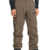 Quiksilver Utility Shell Pant 2025 - A pair of khaki-colored snow pants with a black logo patch on the left thigh and two zippered pockets on the right leg.