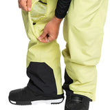 Quiksilver Utility Shell Pant 2025 - A pair of khaki-colored snow pants with a zippered pocket on the thigh and black accents around the ankles.