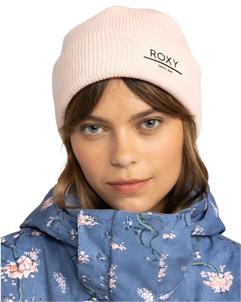 Roxy Women's Folker Beanie 2025 - A light pink beanie with a ribbed cuff and "ROXY" logo on the front.