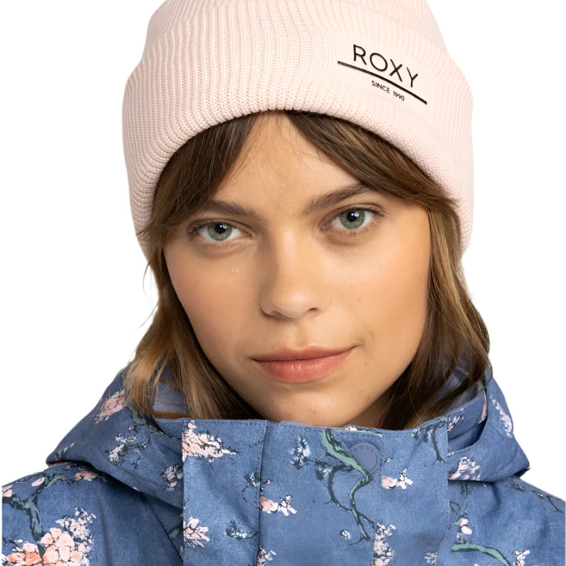 Roxy Women's Folker Beanie 2025 - A light pink beanie with a ribbed cuff and "ROXY" logo on the front.