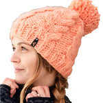 Roxy Women's Winter Beanie 2025 - A light pink beanie with a pom-pom on top.