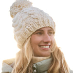 Roxy Women's Winter Beanie 2025 - A cream-colored beanie with a chunky knit pattern and a large pom-pom on top.