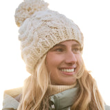 Roxy Women's Winter Beanie 2025 - A cream-colored beanie with a chunky knit pattern and a large pom-pom on top.