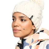 Roxy Women's Winter Beanie 2025 - A cream-colored beanie with a black tag on the side featuring a white logo.