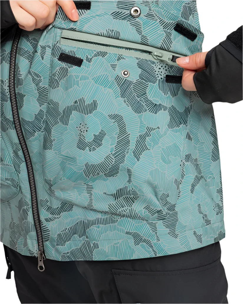 Roxy Women's Stated Insulated Jacket 2025 - A woman wearing a light blue jacket with black stripes and a floral pattern, zipping up the front.