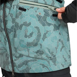 Roxy Women's Stated Insulated Jacket 2025 - A woman wearing a light blue jacket with black stripes and a floral pattern, zipping up the front.