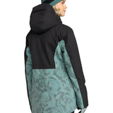 Roxy Women's Stated Insulated Jacket 2025 - A black and teal floral patterned jacket with a hood, worn by a model facing left.
