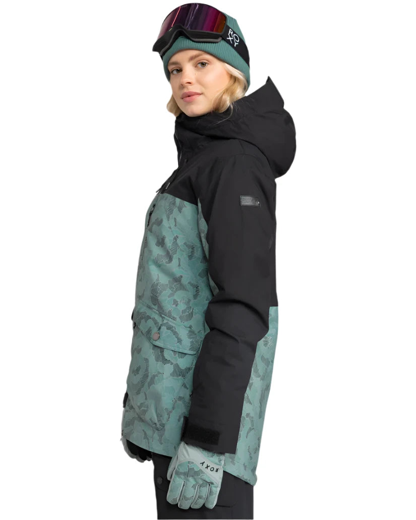 Roxy Women's Stated Insulated Jacket 2025 - A black and teal snowboard jacket with a subtle floral pattern on the front, featuring a hood and two zippered pockets.