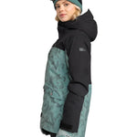 Roxy Women's Stated Insulated Jacket 2025 - A black and teal snowboard jacket with a subtle floral pattern on the front, featuring a hood and two zippered pockets.