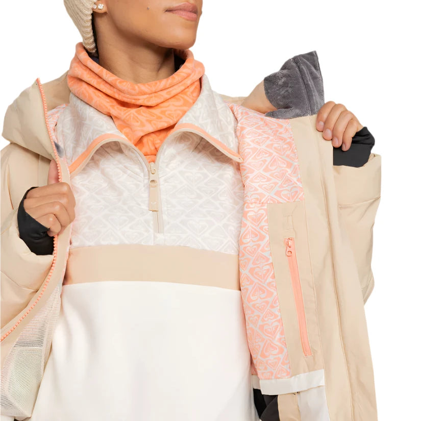 Roxy Women's Alofted Puffy Insulated Jacket - A cream-colored puffer jacket with a zippered front and hood, featuring a geometric pattern on the upper portion of the chest area.