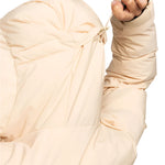 Roxy Women's Alofted Puffy Insulated Jacket - A cream-colored puffer jacket with a hood and drawstring waist, featuring a zippered front and two side pockets.
