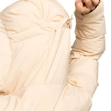 Roxy Women's Alofted Puffy Insulated Jacket - A cream-colored puffer jacket with a hood and drawstring waist, featuring a zippered front and two side pockets.