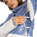 Roxy Women's Chloe Kim Parka Jacket 2025 - A blue parka jacket with a floral pattern and white accents on the sleeves, hood, and trim.