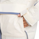 Roxy Women's Chloe Kim Parka Jacket 2025 - A cream-colored parka jacket with a blue floral pattern on the hood and trim.