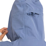 Roxy Women's Chloe Kim Parka Jacket 2025 - A light blue parka jacket with a hood and drawstring waist, featuring a zip closure and two front pockets.