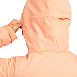 Roxy Women's Meade Insulated Jacket - A woman wearing a peach-colored jacket with a hood, holding it up to show off its design.