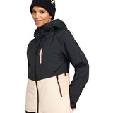 Roxy Women's Peakside Insulated Jacket 2025 - A black and white snowflake patterned beanie is worn atop a woman wearing an insulated jacket with a black upper section, cream-colored lower section, and pink zipper.