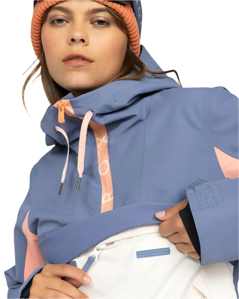 Roxy Women's Shelter Insulated Jacket 2025 - A blue and pink insulated jacket with a hood, featuring white geometric shapes on the front zipper.