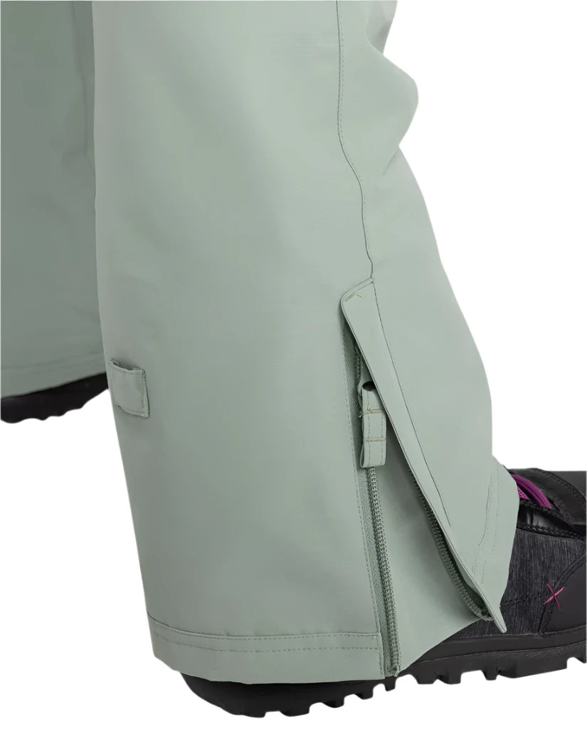 Roxy Women's Rideout Insulated Bib Pant 2025 - A pair of light gray snow pants with a zippered pocket on the side and a small square patch on the left leg.